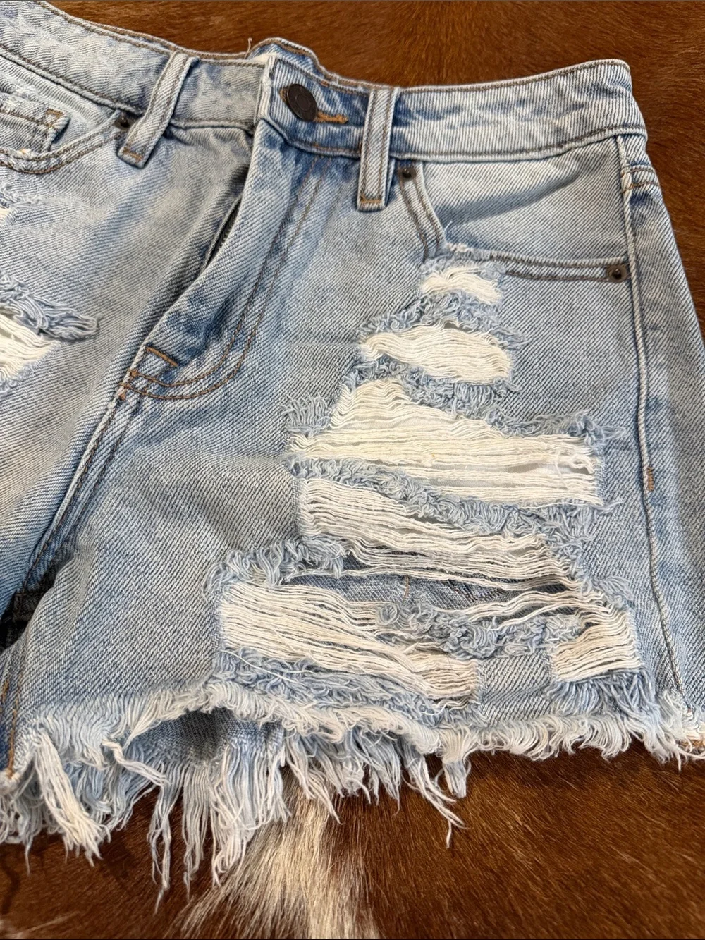 High-Rise Light Blue Distressed Denim Shorts